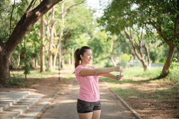 Asian women are stretching their muscles before going out to run to the park to keep themselves...