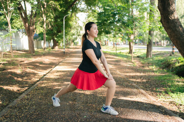 Asian women are stretching their muscles before going out to run to the park to keep themselves...