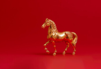 Golden horse on red background, Chinese New Year concept	