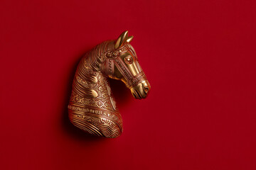 Golden horse on red background, Chinese New Year concept	