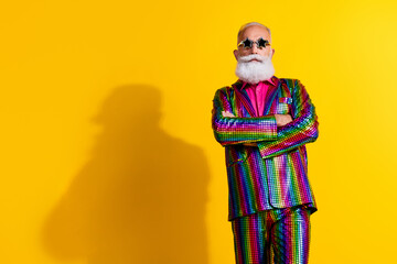 Photo of serious brutal macho man wear trendy striped shiny outfit standing empty space isolated on...