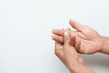 A man uses his other hand to feel pain and tingling, along with Guillain-Barré syndrome and numbness in his hand. An elderly man tries to massage himself to relieve the pain in his wrist.