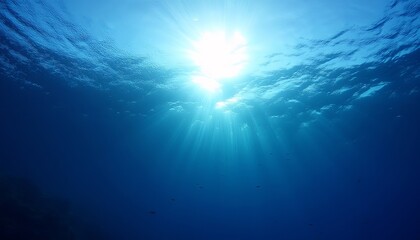 Breathtaking Underwater View Sunlight Piercing the Deep Blue Ocean, Creating a Serene and Tranquil Atmosphere with Rays of Light