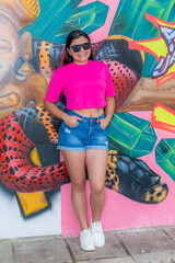 Full Body Portrait of Latina Woman in Pink Top and White Sneakers