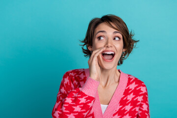 Photo of tricky impressed lady wear red cardigan telling secret looking empty space isolated...