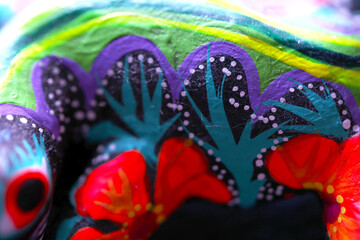 Fototapeta premium Macro photo of a vibrantly painted wooden animal
