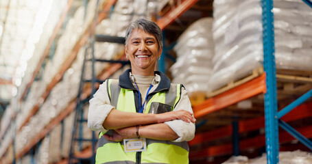 Woman, arms crossed and happy at warehouse for logistics, pride or low angle for supply chain...