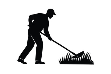 Silhouette of Man Mowing Grass