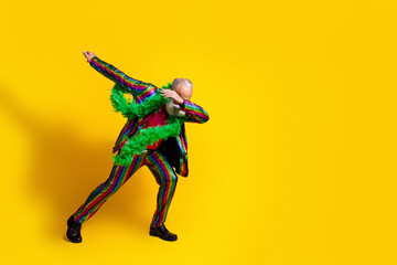Photo of cool crazy charismatic man pensioner wear stylish striped suit have fun isolated on yellow color background