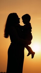 Mother-child silhouette during warm sunset symbolizing bond and affection