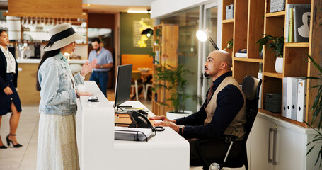 Man, woman and concierge with welcome at hotel reception with reservation, discussion or booking...