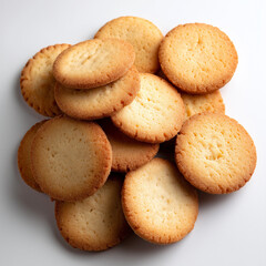a top down view of a pile of round vanilla cookies isolated on white

