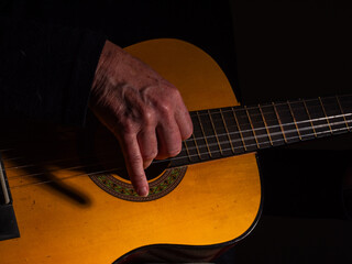 Hands playing guitar close up shot 