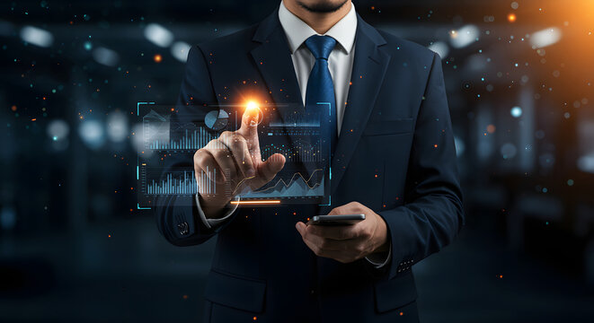 A businessman in a suit interacts with a transparent holographic screen displaying financial charts and graphs, using his finger and mobile phone. The image showcases data analysis and modern busines