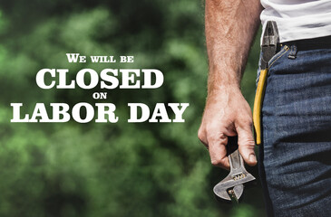 Signboard with the inscription We will be closed on Labor Day. Congratulations for family, loved...
