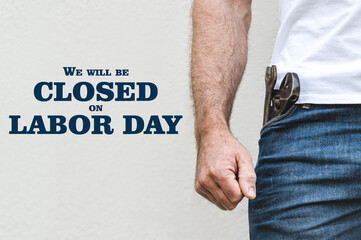 Signboard with the inscription We will be closed on Labor Day. Congratulations for family, loved...