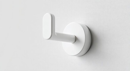 Minimalist white wall hook with rounded edges and a circular base, mounted on a plain white background