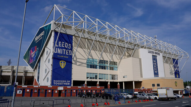 LEEDS, UK - JUNE 12, 2025 - Elland Road stadium, home of Leeds United Football Club, displaying large banners and signage under a clear blue sky
