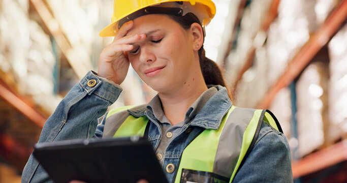 Woman, stress and tablet in waregouse logistics for mistake, anxiety or supply chain issue. Female person, distributor or supplier with headache on technology for inventory loss, fail or stock error