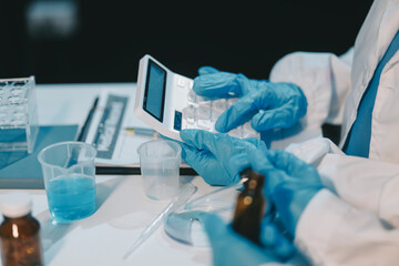 Research, experiment and medical trial being done by a scientist in a lab, science facility or...