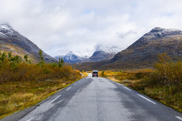 Fototapeta premium Motorhome camper in autumn in Trollstigen road in Norway, Europe