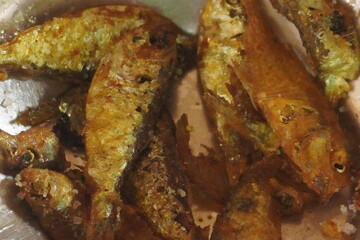 Crispy fried fish with golden-brown coating and tender, flavorful meat, perfect for seafood lovers, served hot with sauces or side dishes