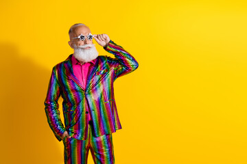 Charismatic gentleman in a funky striped suit on a vibrant yellow background, embodying style and...