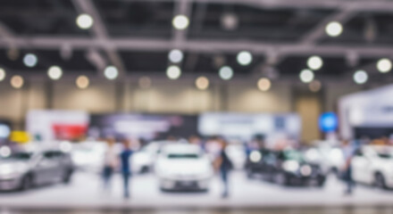 Fototapeta premium Immersive Blurred View of a Vibrant Car Show Exploring the Excitement of New Models, Crowds, and the Automotive Industry's Latest Innovations