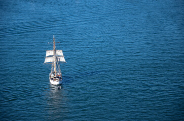 Sydney, New Sowth Wales, Australia. May 21, 2013: A sailboat navigating the blue waters of Sydney Harbour, Australia.