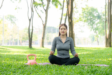 Woman Meditating Outdoors in Park