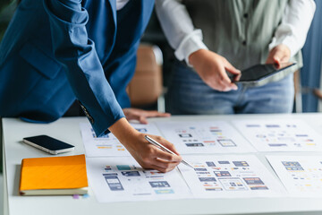 UI designer and UX specialist collaborating on digital prototype in session