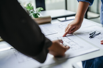 Engineer working on interior project blueprint in professional office