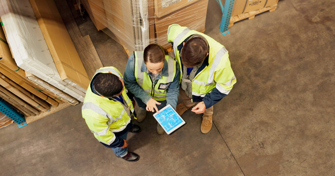 People, tablet and team at warehouse for logistics, above or blueprint on screen at storage plant. Men, woman and tech for inventory, collaboration or floor plan for factory with meeting for shipping