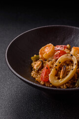 Rice and prawns or paella, a meal with seafood and vegetables. Cooked rice with shrimp