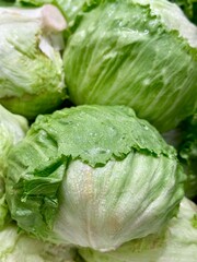 Fresh iceberg lettuce with crisp green leaves, perfect for salads, healthy meals, and fresh kitchen content