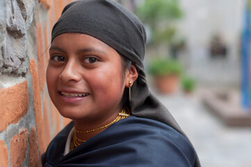 Smiling indigenous girl wearing traditional clothes and jewelry