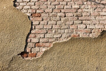Brick wall with falling mortar cover