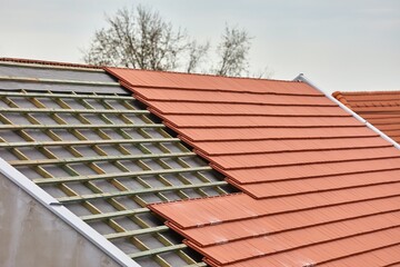 Roof tiles put on a house under construction