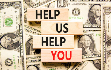 Help you symbol. Concept words phrase Help us help you on beautiful wooden blocks. Dollar bills....