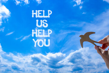 Help you symbol. Concept words phrase Help us help you on beautiful blue sky. Businessman's hand....