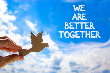 We are better together symbol. Concept words phrase We are better together on beautiful sky....
