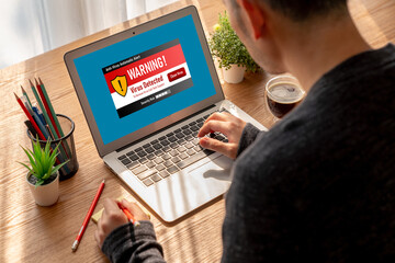 Virus warning alert on computer screen detected modish cyber threat , hacker, computer virus and...
