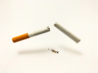 broken cigarette on light background