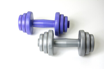 Two dumbbells isolated on white background, closeup of photo