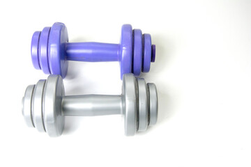 Two dumbbells isolated on white background, closeup of photo