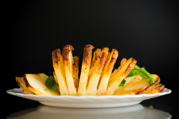 Crispy baked potatoes in a country style