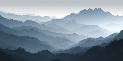 A distant view of layered blue mountains fading into the horizon in a hazy atmospheric scene