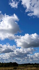 Sunny Sky with Fluffy Clouds, and Landscape.