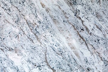Close-up of a polished marble stone surface with intricate veins and patterns