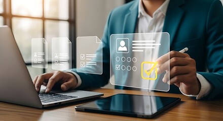 Professional using laptop and tablet interacting with digital checklist and resume files